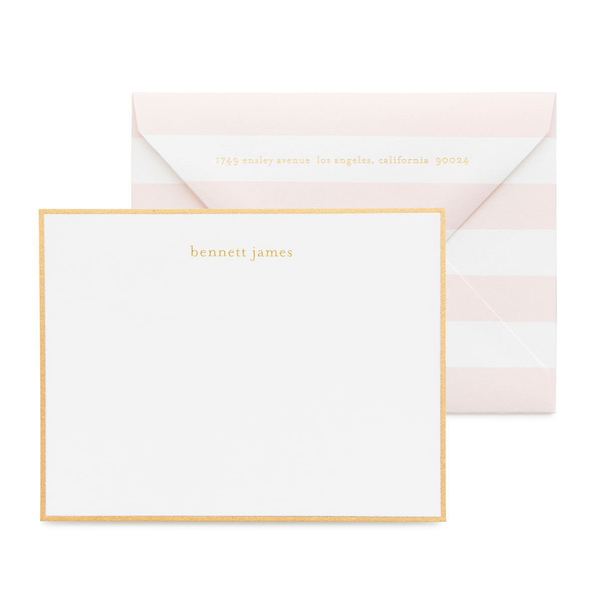 White and gold custom stationery with a pink stripe envelope