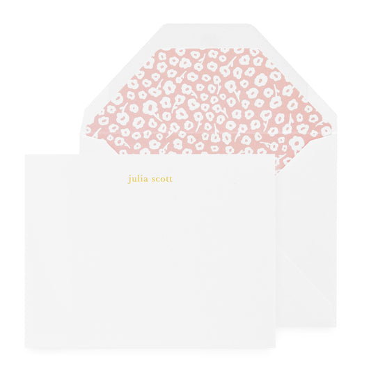 white card with gold foil text, white envelope with pink floral liner