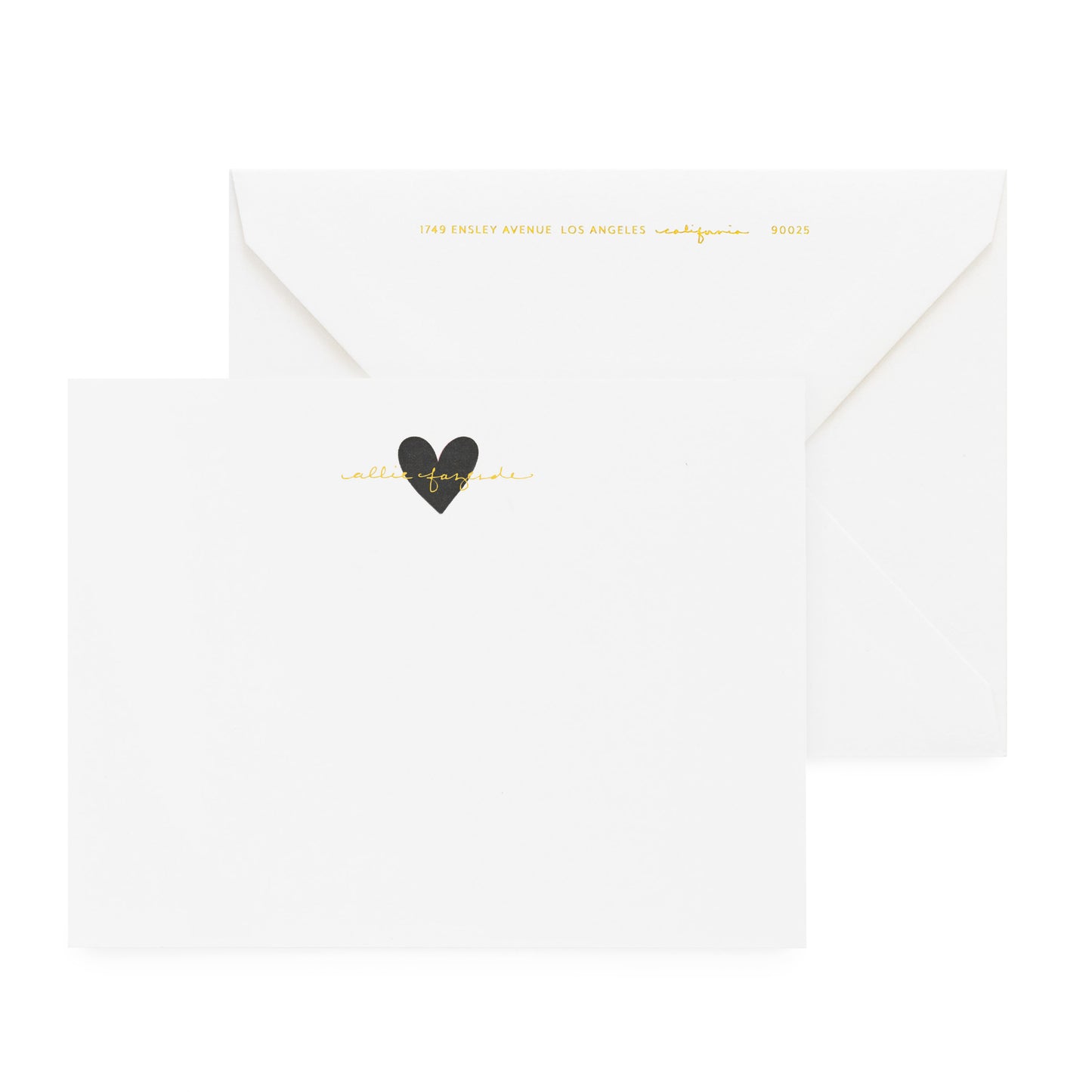 white card with black heart and gold foil text, white envelope