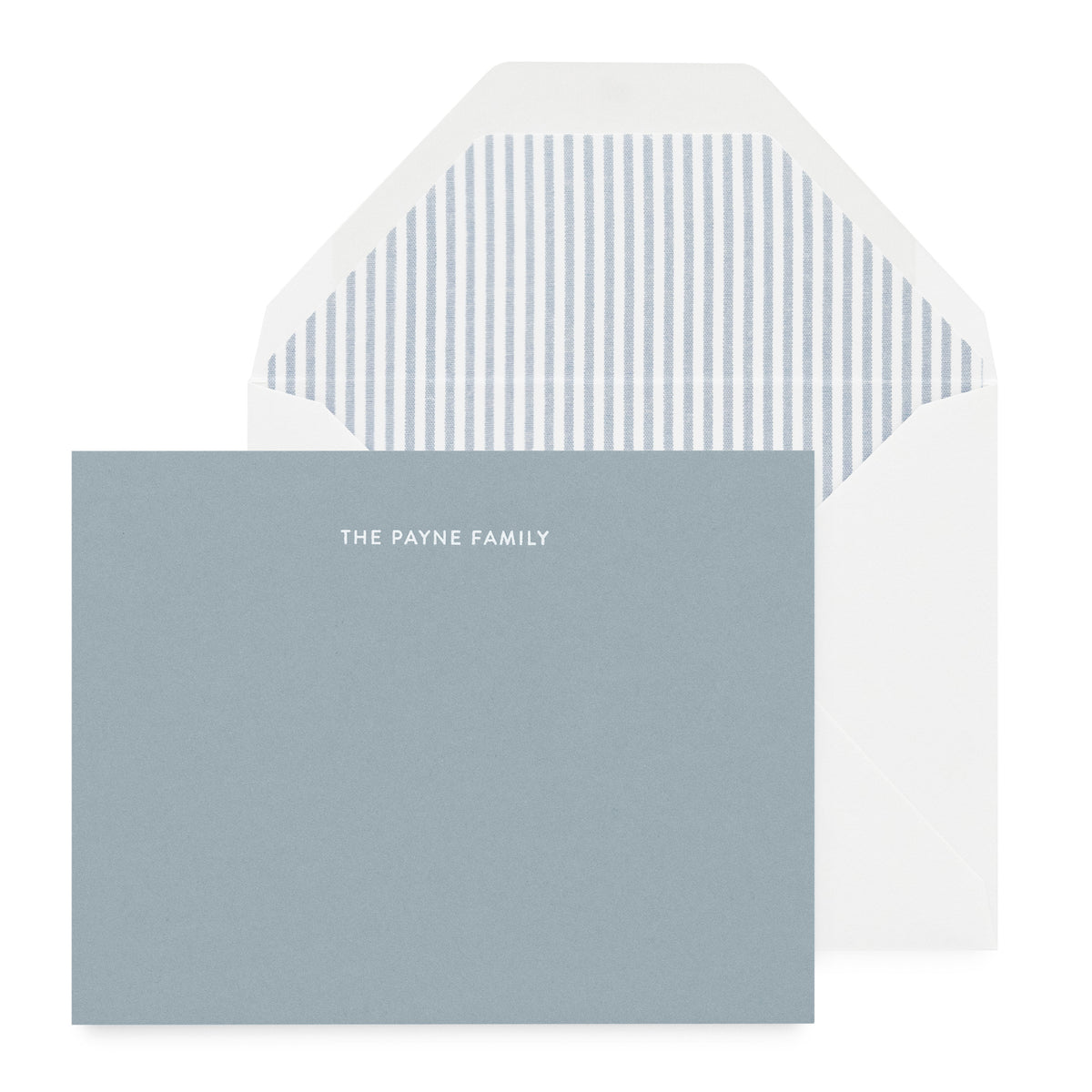 blue card with white foil text, white envelope with blue striped liner