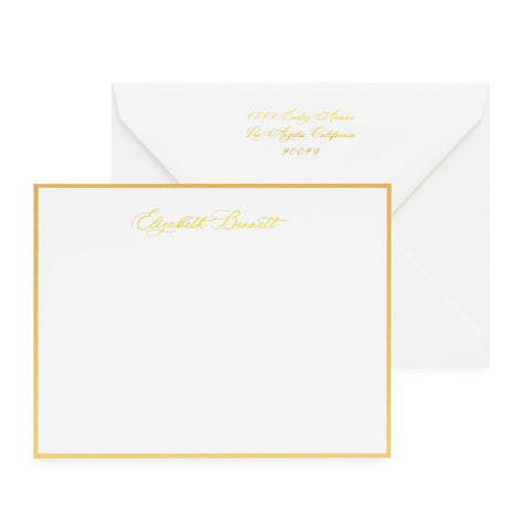 white card with gold border and gold foil text, white envelope