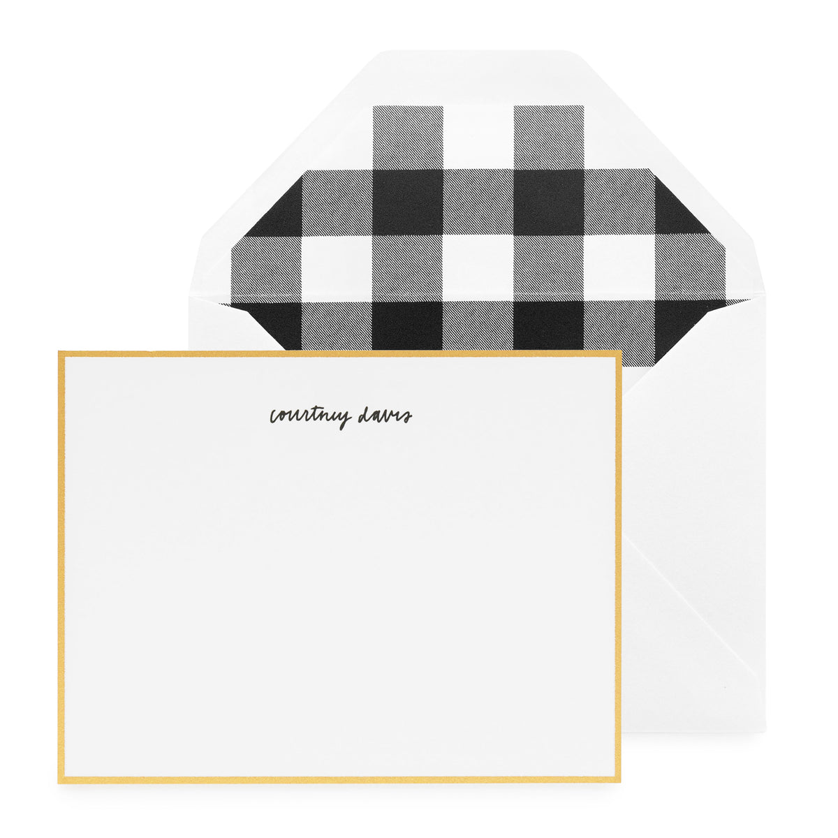 white card with gold border and black text, white envelope with black buffalo check liner