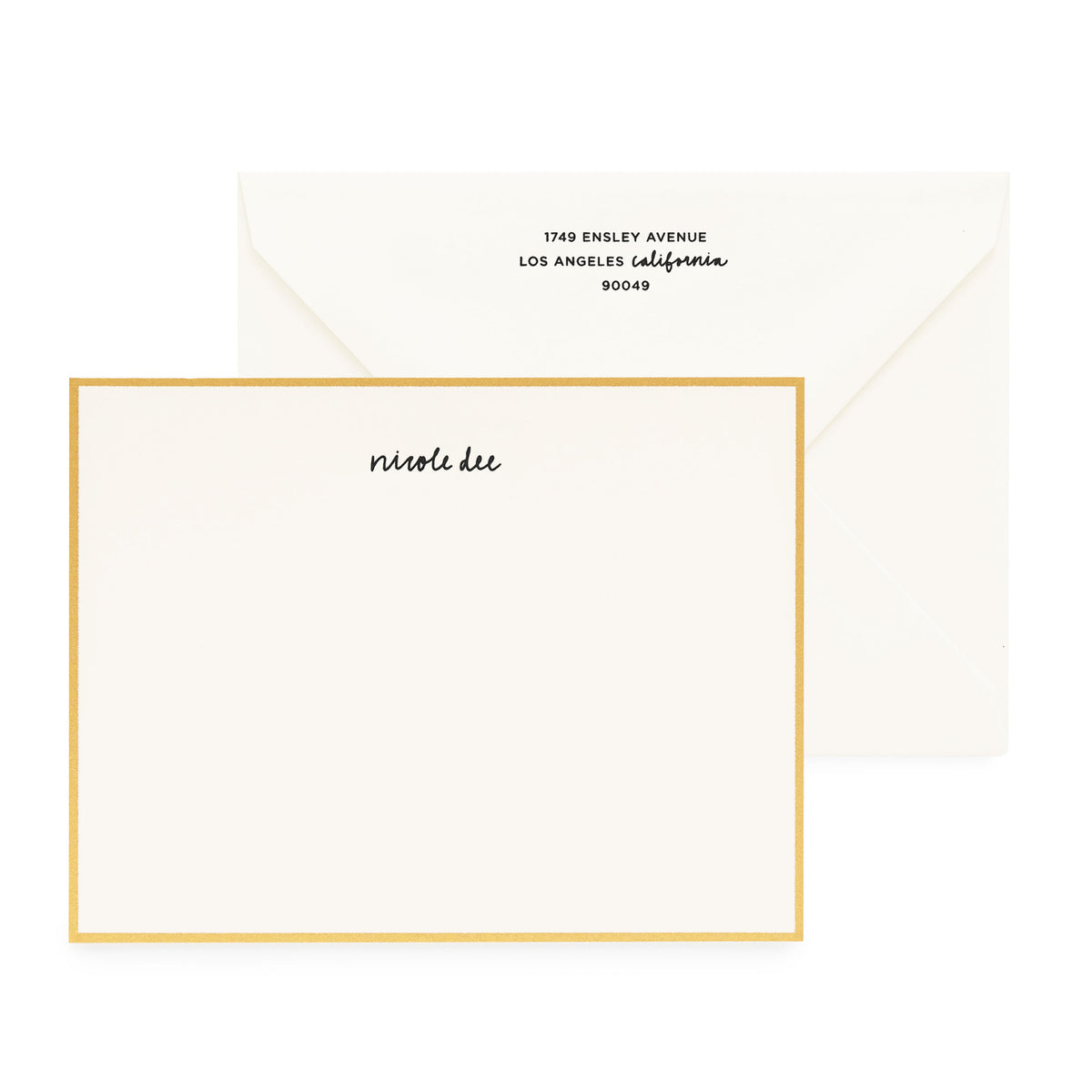 cream card with gold border and black text, cream envelope with black text