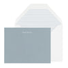 Slate blue stationery with white foil name and blue and white striped envelope liner