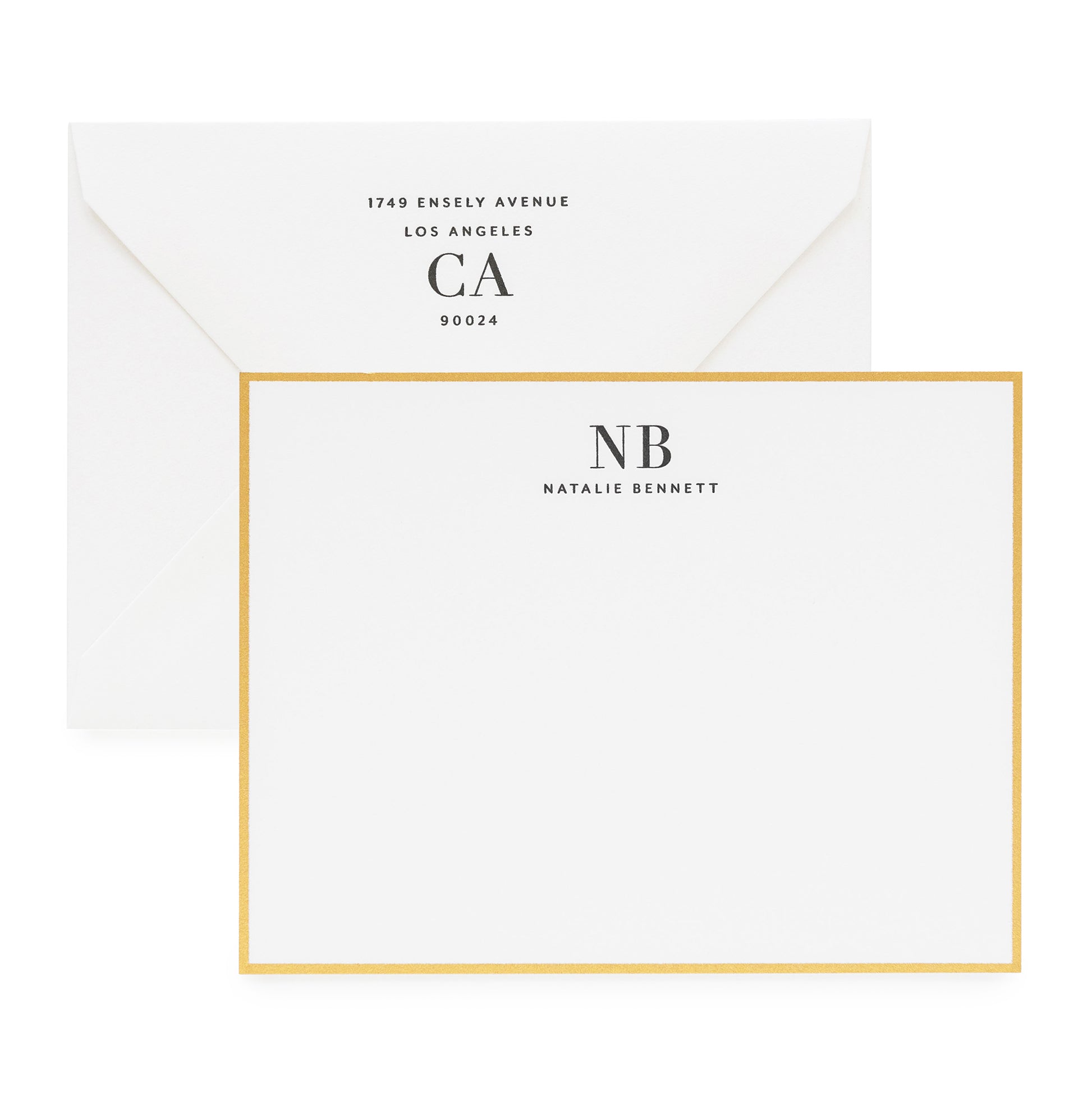 Black and white custom stationery with large initials and gold border