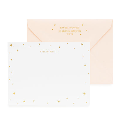 White with gold heart and star stationery with a pink envelope