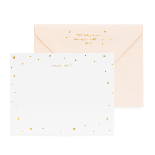 White with gold heart and star stationery with a pink envelope