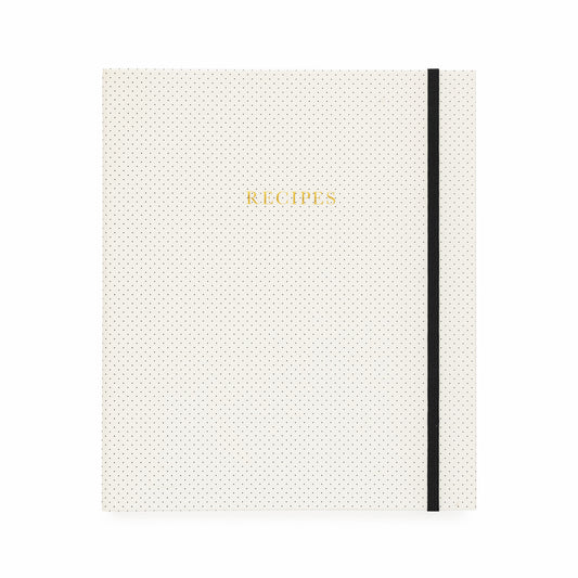 Cream and black dot binder with gold foil recipes and a black elastic closure