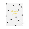 white card with black scattered dots and gold foil thank you