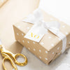 kraft gift with xo tag and white bow