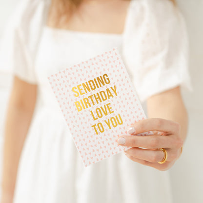 person holding birthday love card