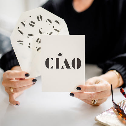 person holding ciao card