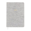 Grey fabric journal with gold foil monogram on cover