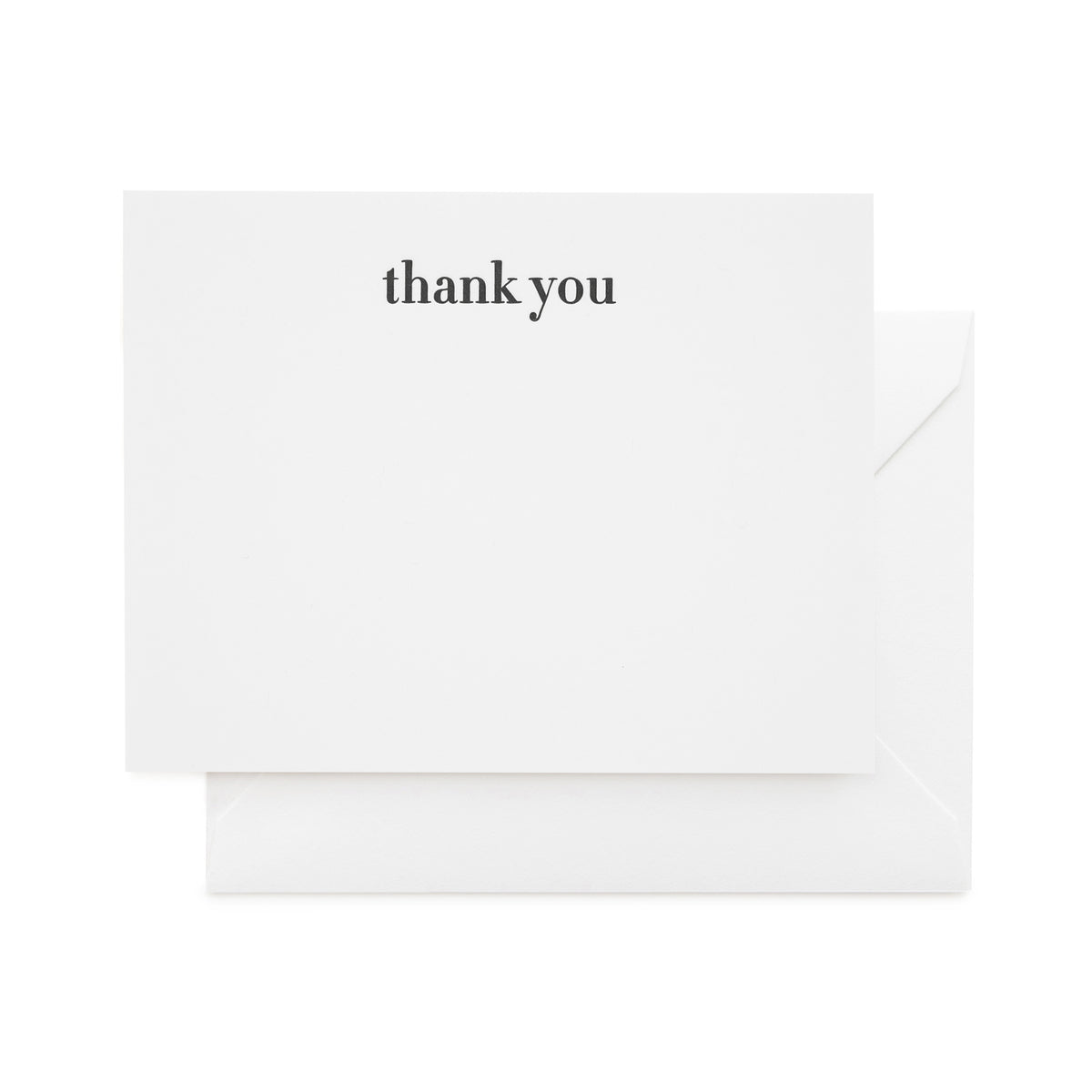 white card with black thank you text and white envelope