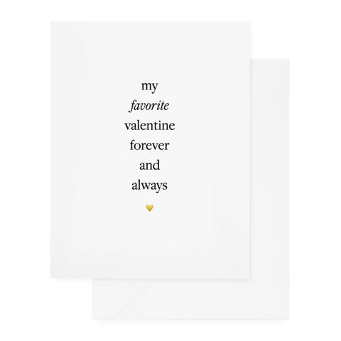 white card with black text and gold foil heart and white envelope