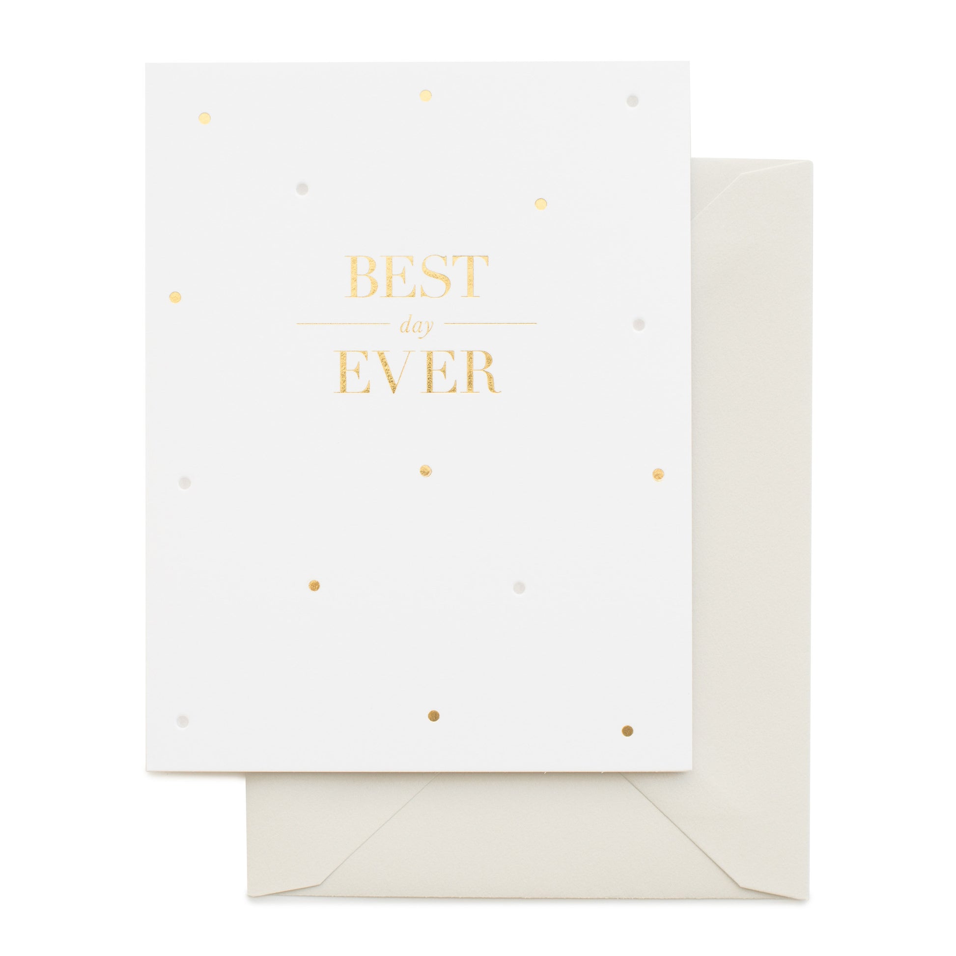 White greeting card printed in gold with "Best Day Ever" and a polka dot design paired with a grey envelope