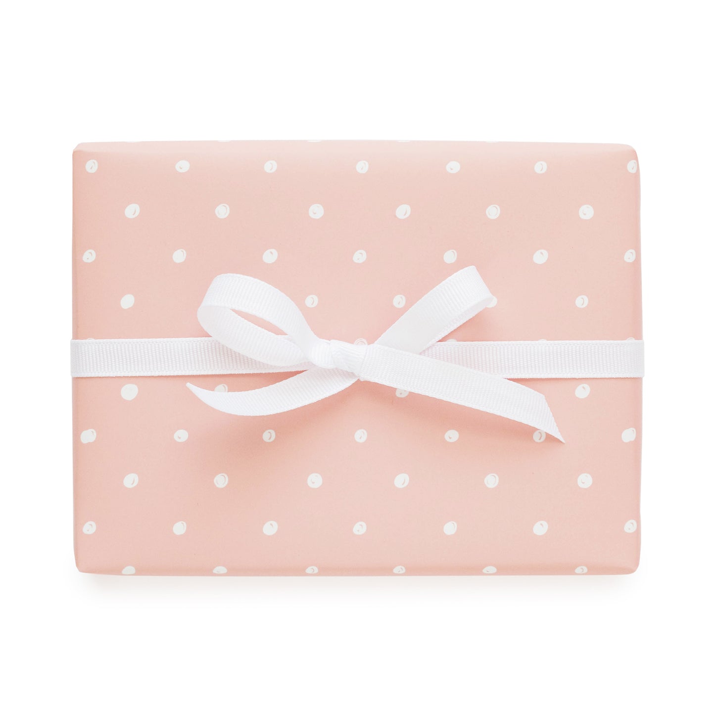 rose gift wrap with imperfect white dots and white bow