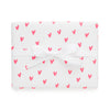 white gift wrap with neon pink hearts and white bow